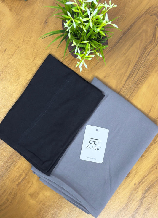 Soft smoke grey hijab with a secure black cap.