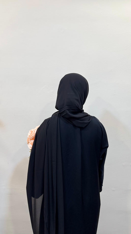 Black hijab with a sleek, timeless look, styled with elegance and simplicity.
