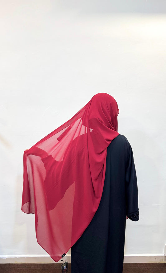 Cherry red hijab with a bold, vibrant hue, adding a pop of color to the look.