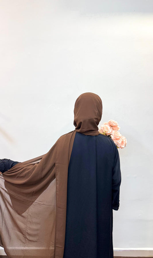 Mocha brown hijab with a rich, earthy tone, draped gracefully in soft folds.