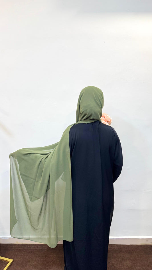 Hijab in a rich olive green shade, blending elegance with a touch of nature-inspired style.