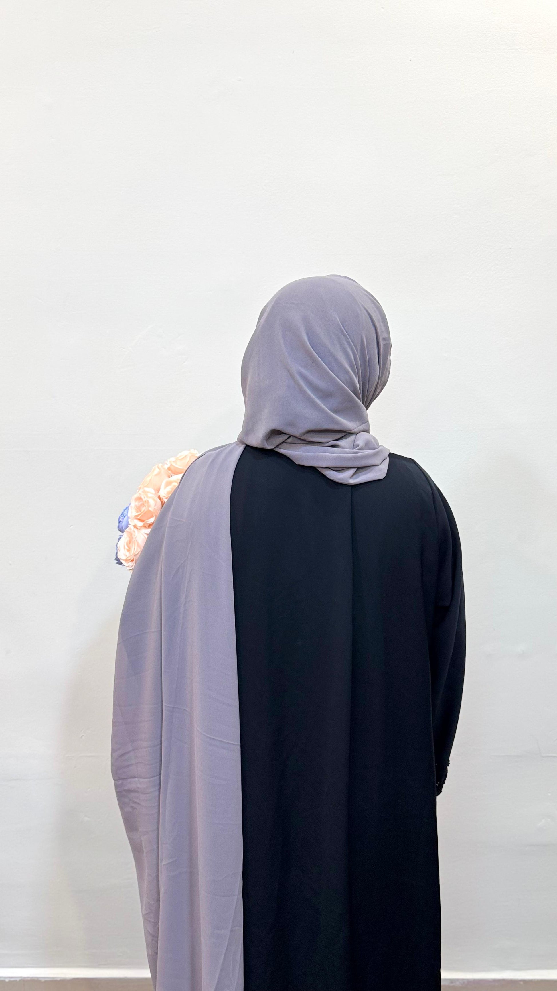 Hijab in a soft smoke grey shade, offering a subtle and sophisticated look.
