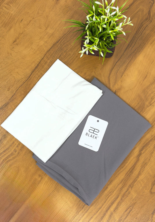 White cap with smoke-colored slider mag hijab, folded.