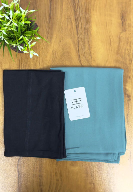 Folded slider mag hijab in mint green with black cap.