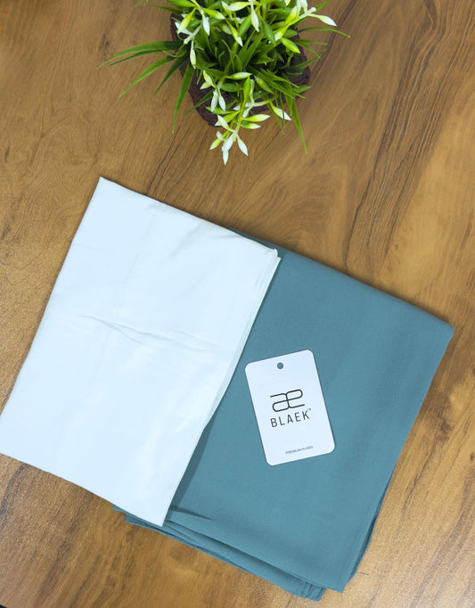 Slider mag hijab featuring mint green shawl and white cap, folded.