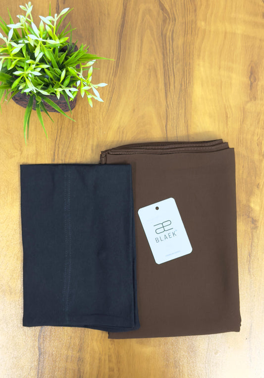 Mocha slider mag hijab paired with black cap, folded neatly.