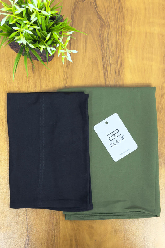 Folded olive green shawl attached to black cap, slider style.