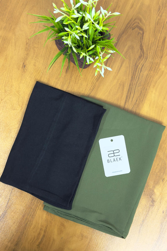 Olive green slider mag hijab neatly paired with black cap.