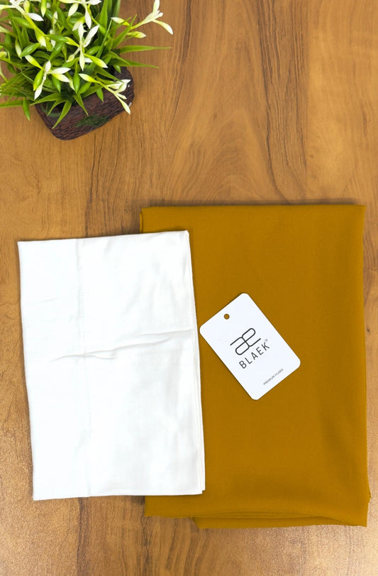 Lightweight mustard hijab with a structured white cap for a polished finish.