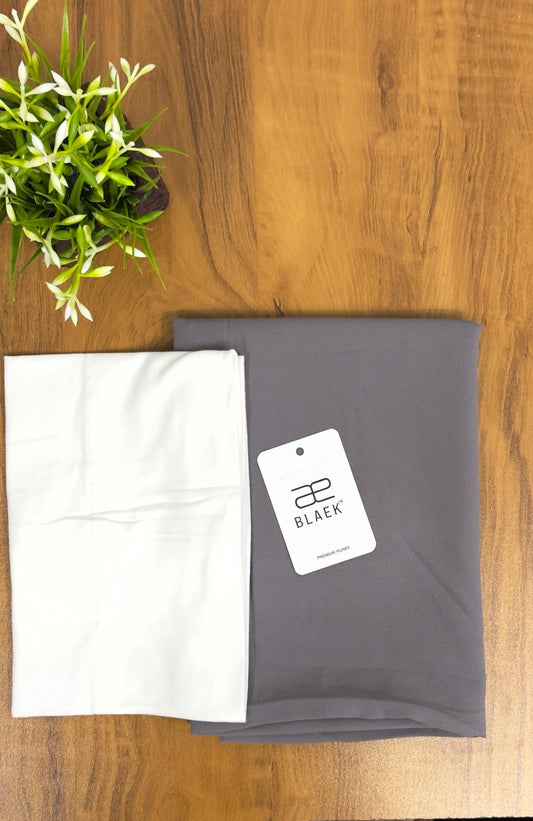 Lightweight smoke grey hijab with a fitted white cap for a polished look.
