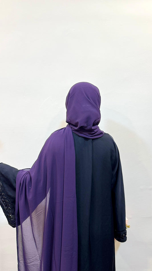 Eggplant purple hijab with a deep, luxurious tone, adding a bold yet sophisticated flair.