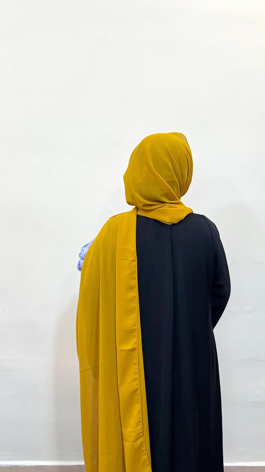 Mustard yellow hijab with a warm, golden tone, perfect for a vibrant yet earthy style.