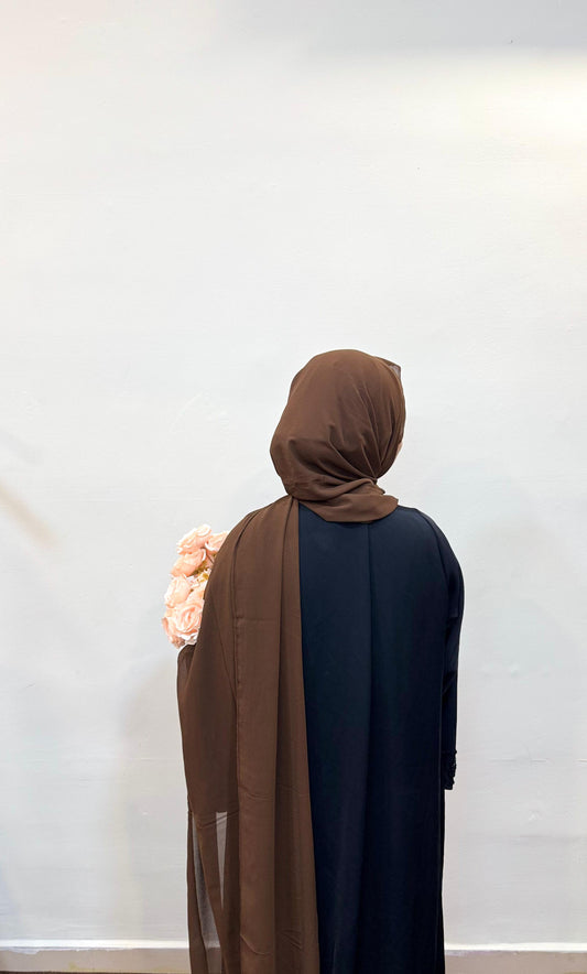 Mocha brown hijab with a rich, earthy tone, draped gracefully in soft folds.