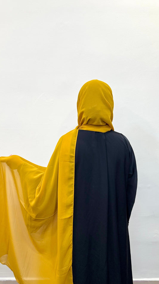 Mustard yellow hijab with a warm, golden tone, perfect for a vibrant yet earthy style.
