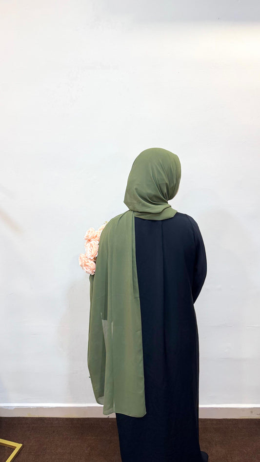 Hijab in a rich olive green shade, blending elegance with a touch of nature-inspired style.