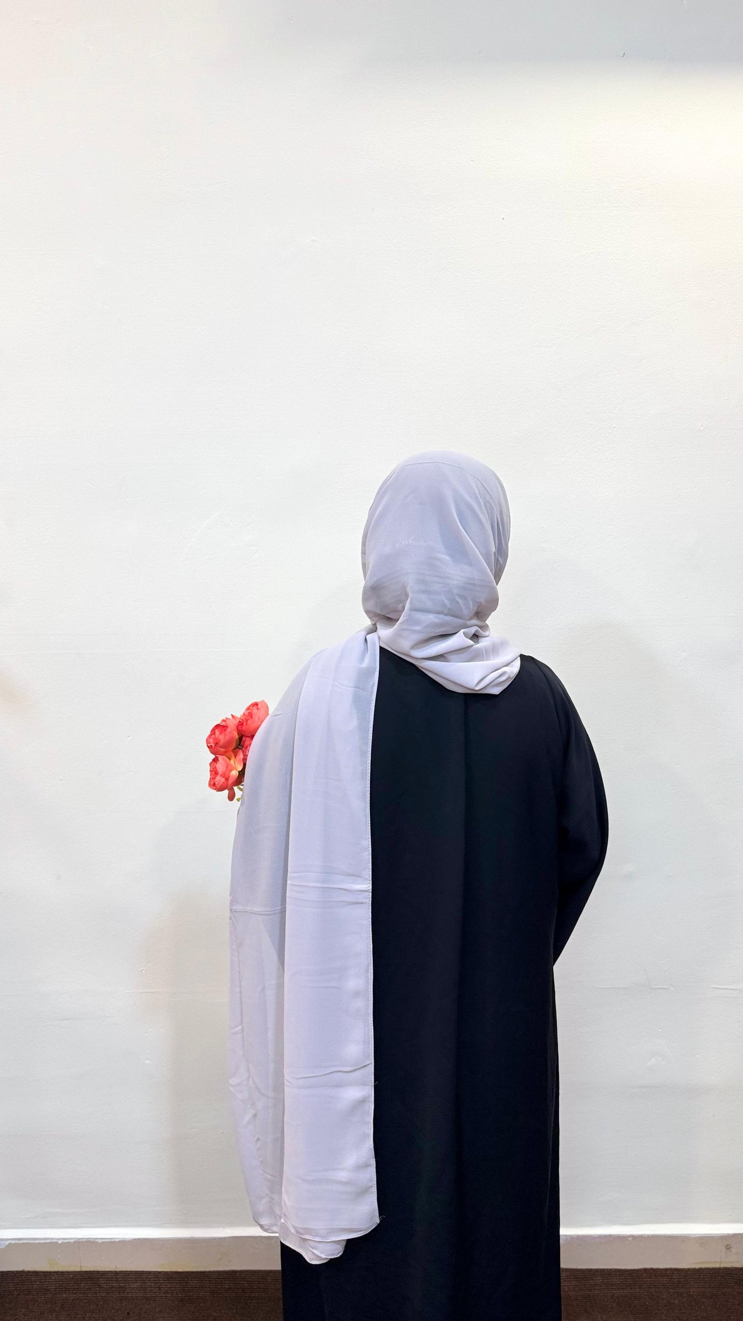 Silver hijab with a soft light grey tone, exuding elegance and a subtle metallic sheen.