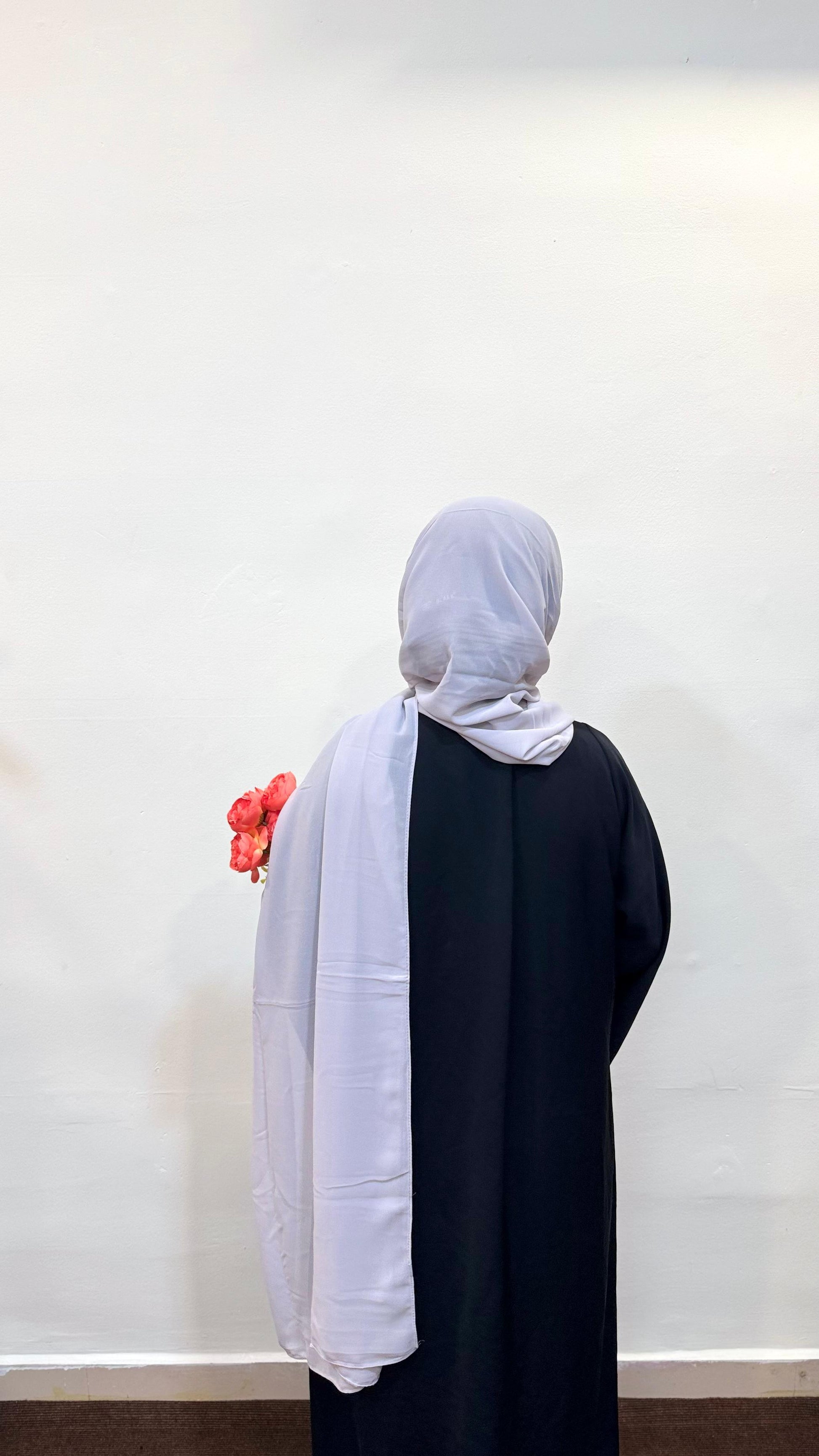 Silver hijab with a soft light grey tone, exuding elegance and a subtle metallic sheen.