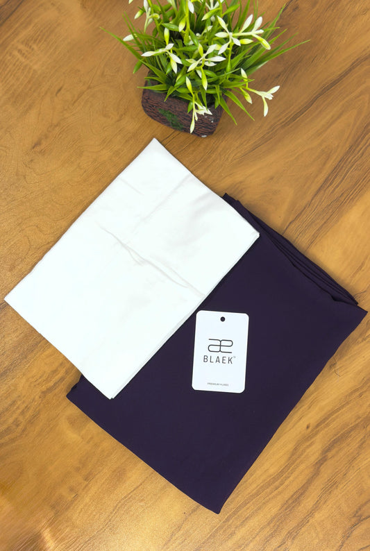 Eggplant slider hijab paired with white cap, folded.