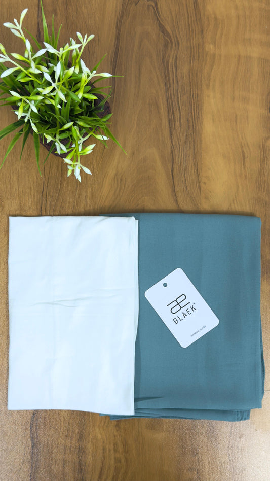 Folded slider mag hijab in mint green with white cap.