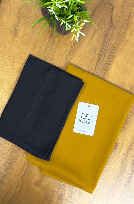 Folded mustard hijab and black cap, slider mag combination.